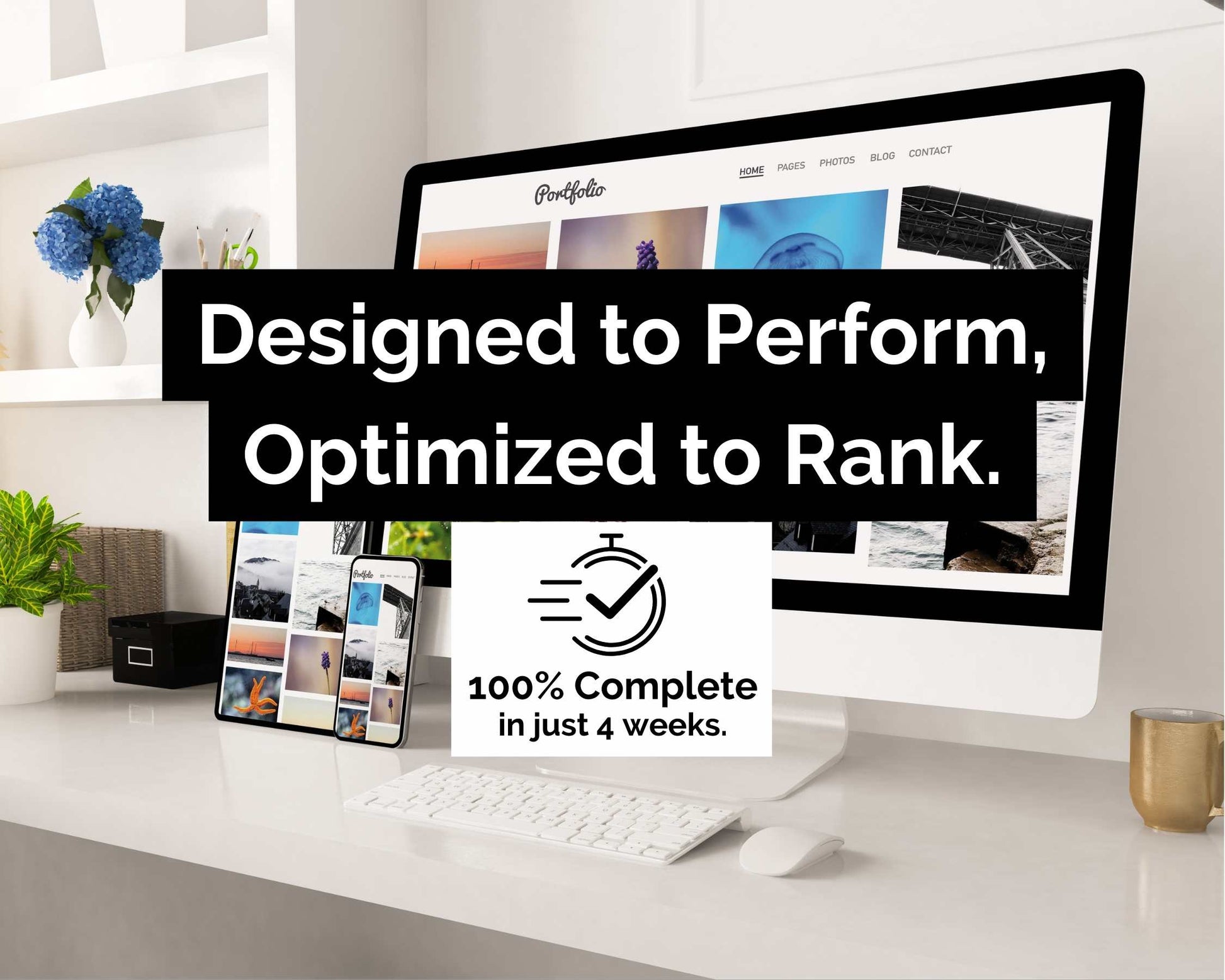 A desk featuring a computer and phones showcasing a mobile-friendly website. Text on screen: "Advanced Website Design Package - Designed to Perform, Optimized for Top Rankings. Brought to you by Socially Inclined, SEO fundamentals guarantee completion in just 4 weeks.