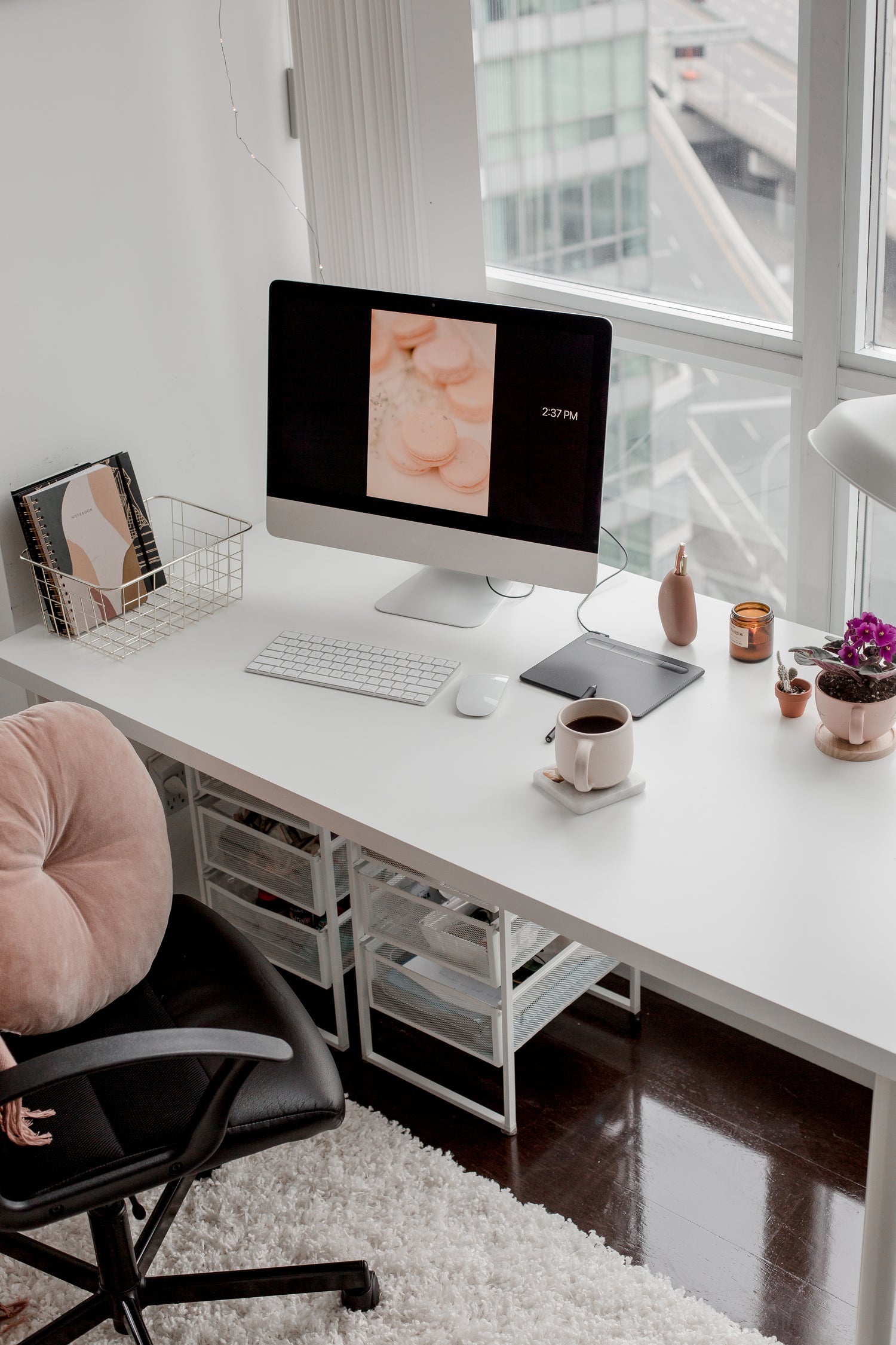 a pink and black workspace for a small business owner